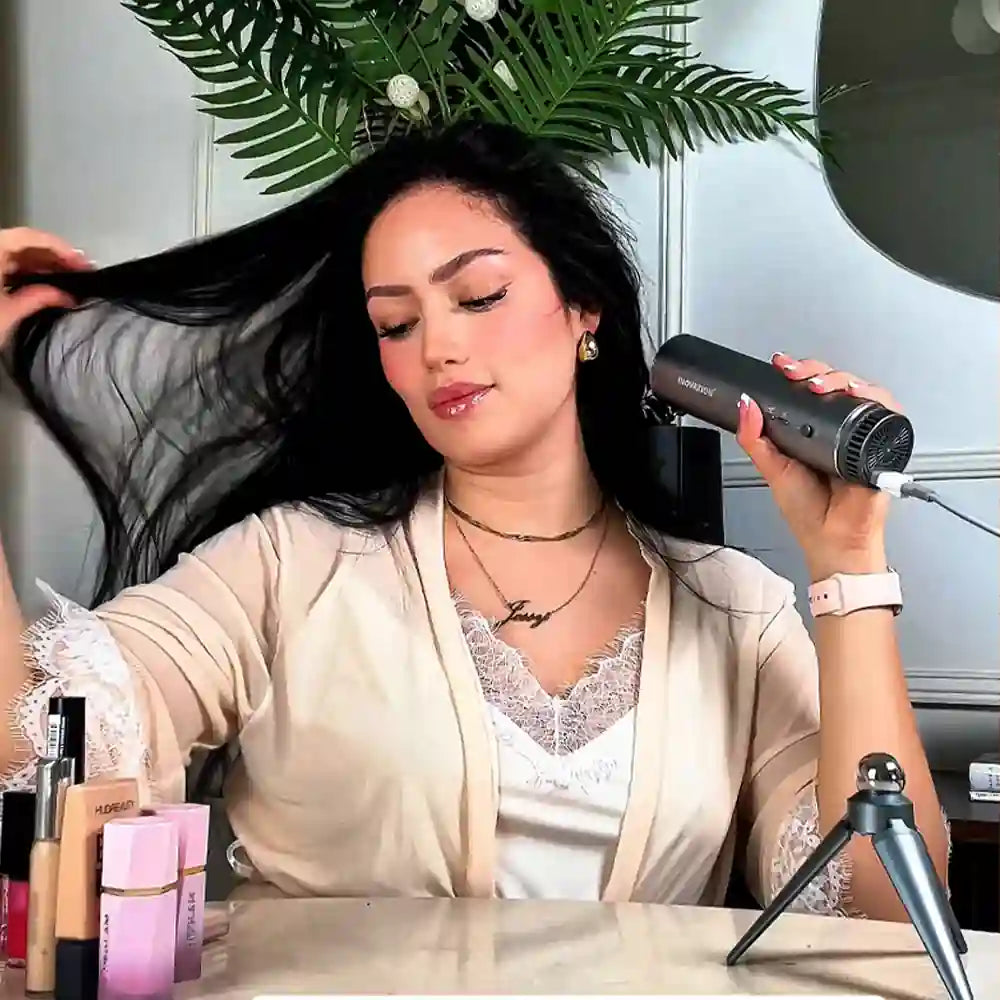 Woman using a handsfree hair dryer in a bathroom setting